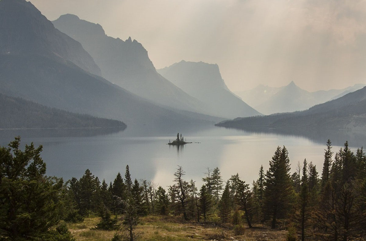 Clouds over the silhouette of a mountain
